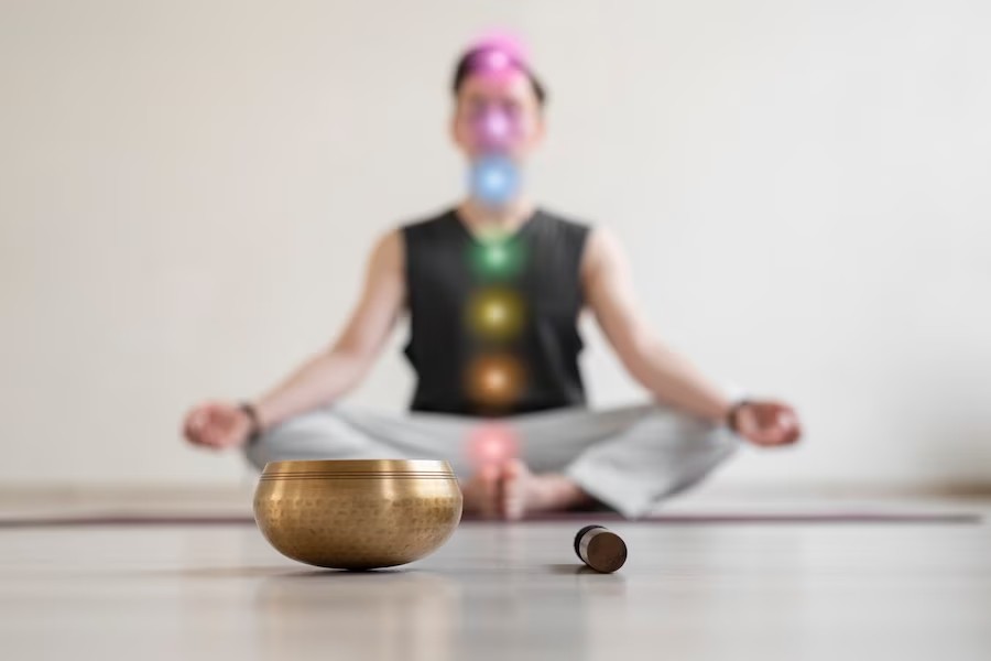 spiritual-young-man-practicing-yoga-indoors_23-2149163293